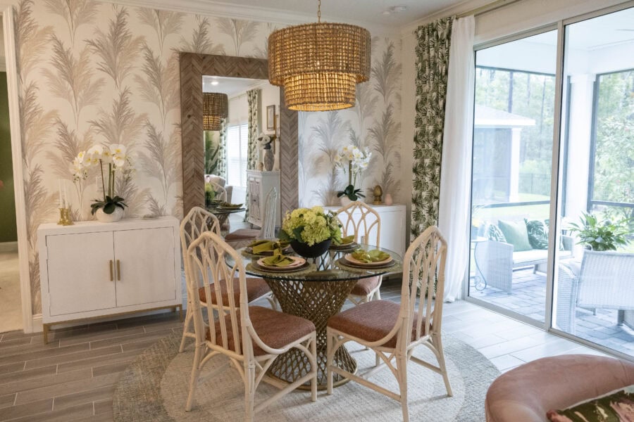 palm themed wallpaper on accent wall in dining room