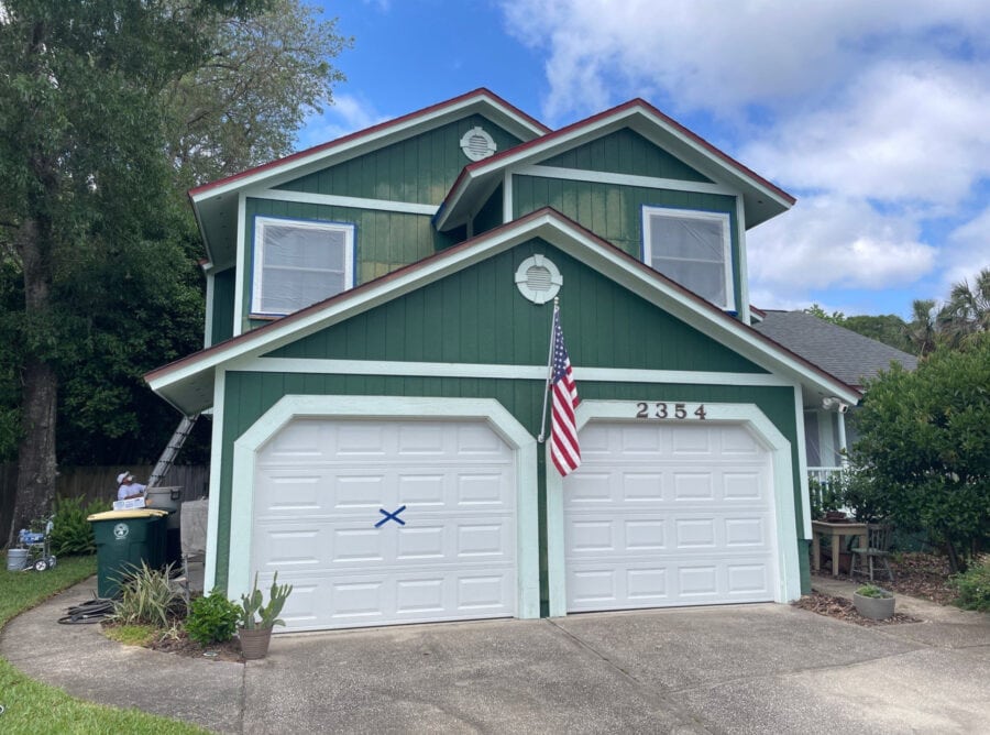 front of house before wood repair and exterior painting