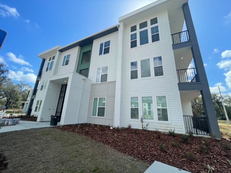 Natura exterior shot of finished paint job on one building facade