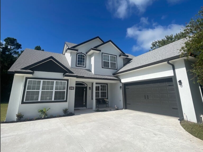 After exterior image ofa white and black house