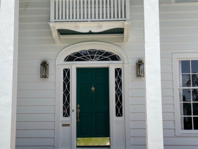 After exterior image of a white house