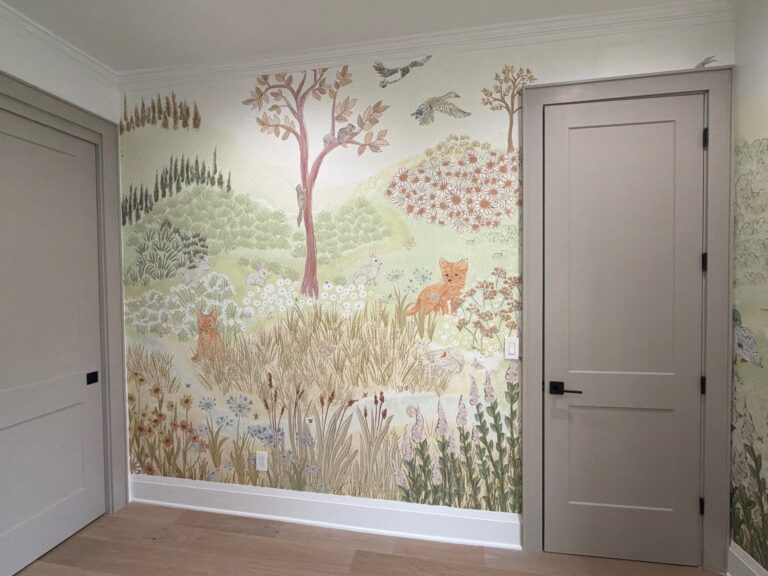 full wall featuring nursery wallpaper of woodland scene with tree, fox, and flowers