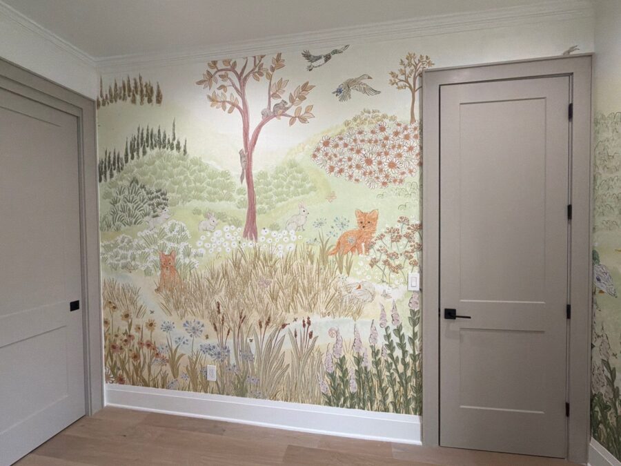 full wall featuring nursery wallpaper of woodland scene with tree, fox, and flowers