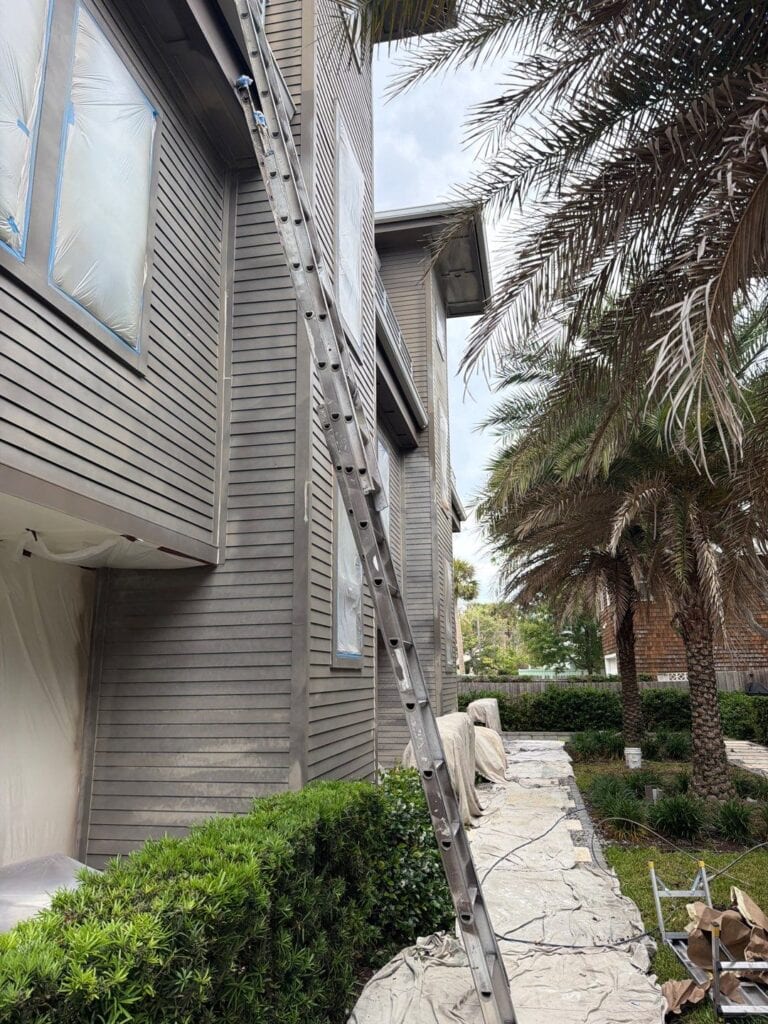 side view of the ahern townhomes with a ladder up the side of the complex