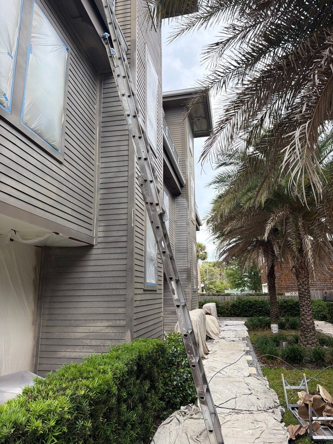side view of the ahern townhomes with a ladder up the side of the complex