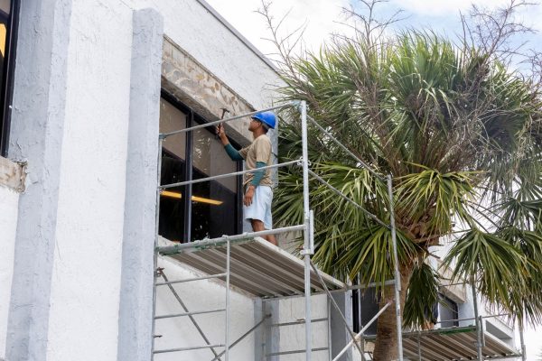 A man doing stucco repair