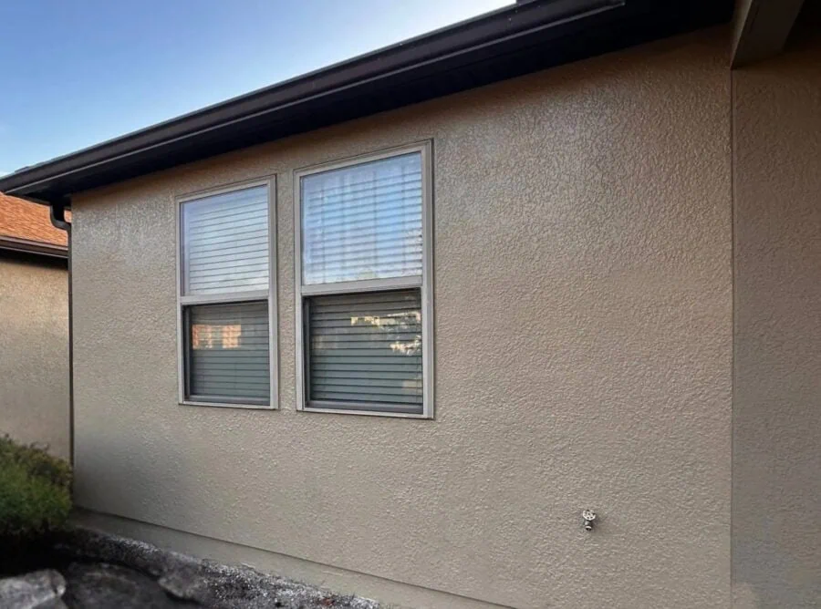 stucco exterior wall of home with repair and new paint for a fresh look